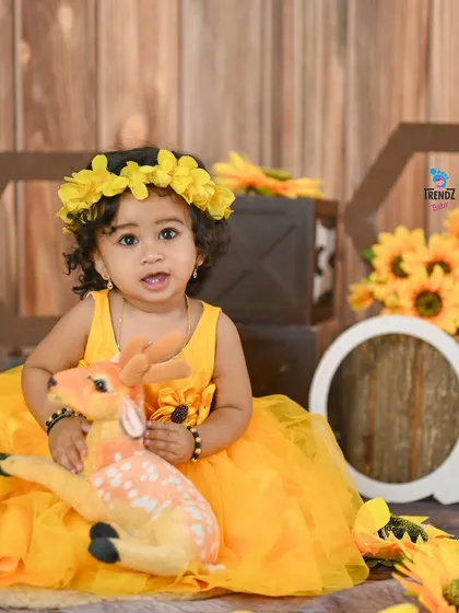 A duplicate of image 158, a lovely sunflower-themed first birthday portrait.