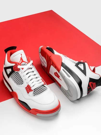 A great e-commerce shot is all about clean lines and bold color. For these sneakers, I used a simple, two-tone background to make the red and white of the shoe pop. It’s a minimalist approach that puts all the focus on the product's design and details.