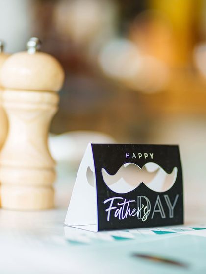 A "Happy Father's Day" card sits on a table at Terra. We pay attention to the small details to make every celebration special for you and your loved ones.