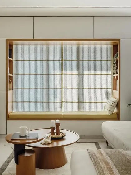 This cozy window seat was part of a larger living room project. I built the entire unit, including the seating, the flanking bookshelves, and the overhead storage. It’s a great example of how I create multifunctional, built-in furniture that maximizes space.
