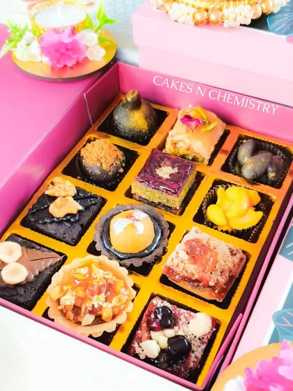 This assorted mithai box from my Diwali collection is a modern take on traditional sweets. It features a variety of bite-sized treats like mini tarts, brownies, and fusion fudge squares.
