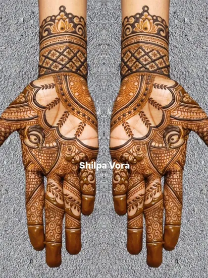 A symmetrical design with bold outlines and delicate inner patterns, creating a striking contrast.