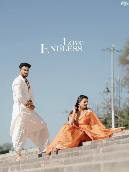 A stylish portrait of a couple in ethnic wear posing on the steps of a Rishikesh ghat.