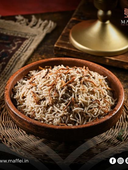 Mujadara rice, a humble yet delicious dish of rice and lentils cooked with spices and topped with a generous amount of crispy fried onions for texture and sweetness.