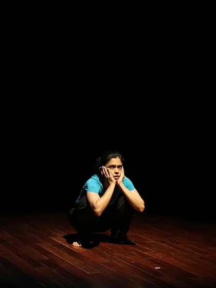 A dancer in a moment of contemplation during a tech run.