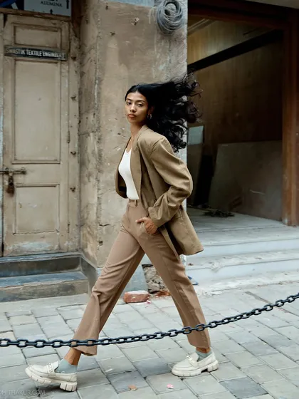 Taking our session to the streets of Mumbai, we captured this dynamic shot. I love using the city's architecture and energy as a backdrop, creating environmental portraits that feel alive with movement and story.