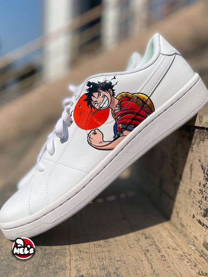 A side view of our custom One Piece themed Nike sneakers. This shot highlights the detailed portrait of Monkey D. Luffy, ready for his next adventure on the Grand Line.