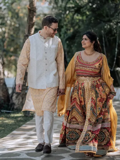 The couple walking hand-in-hand, smiling at each other. The joy and comfort between them is what I aim to facilitate throughout the wedding process.