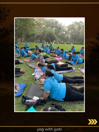A large group practicing Bhujangasana (Cobra Pose) in a park, connecting with nature and their breath.