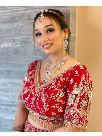 The same client smiling, showing how the makeup looks radiant and beautiful in motion. Perfect for any celebration.