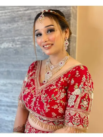 The same client smiling, showing how the makeup looks radiant and beautiful in motion. Perfect for any celebration.