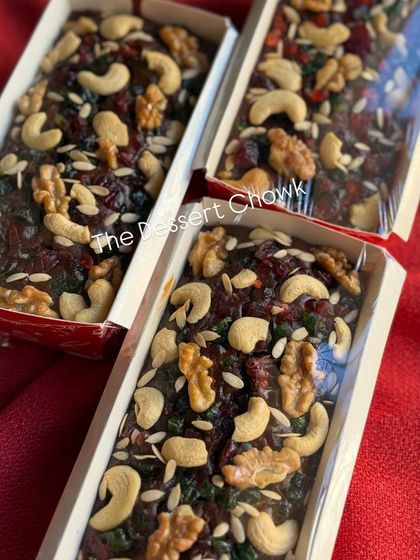 A batch of my Christmas plum cakes, showcasing the rich, dark color and the abundance of fruits and nuts.