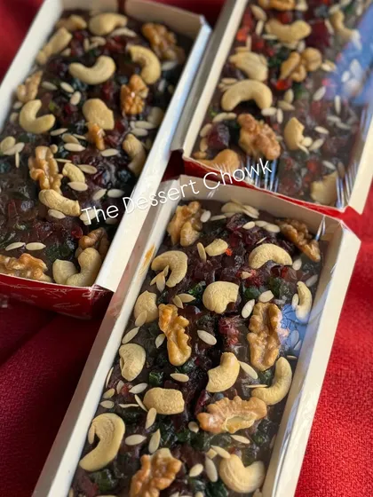 A batch of my Christmas plum cakes, showcasing the rich, dark color and the abundance of fruits and nuts.