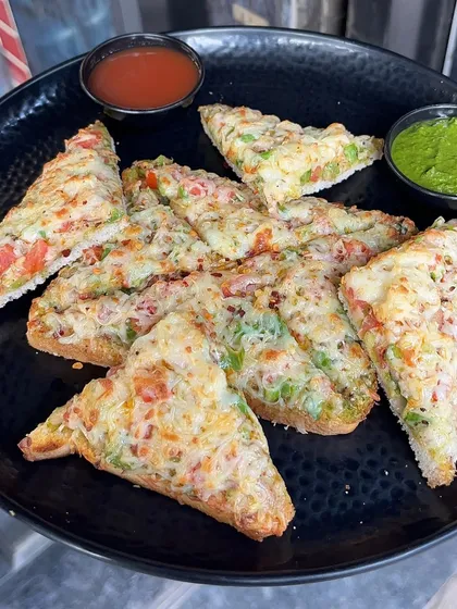 A plate of my Open Cheese Chilli Toast, cut into triangles and ready to be shared. It's a great starter for any meal.