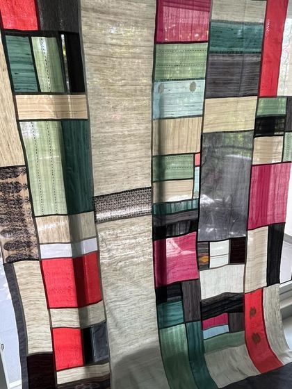 Another detail shot of the Pojagi curtain, showcasing the intricate patchwork of colors and textures.