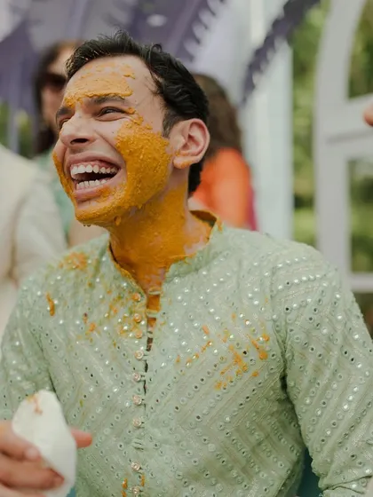 The groom's infectious laughter during his Haldi ceremony. These are the candid moments of pure happiness we love to see.