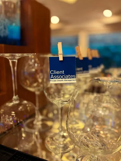 For a corporate event, we created these simple, branded glass tags featuring the "Client Associates" logo. It's a professional and effective way to reinforce branding.