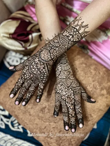 A crossed-hands view, highlighting the symmetry and complementary patterns on both hands for this engagement look.