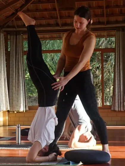 Captions will describe the specific yoga practice shown (e.g., "Practicing Sutra Neti, a traditional yogic cleansing technique," "A Hatha yoga class in our Chakra Hall," "Finding inspiration in our mistakes and using them as a platform for growth.").