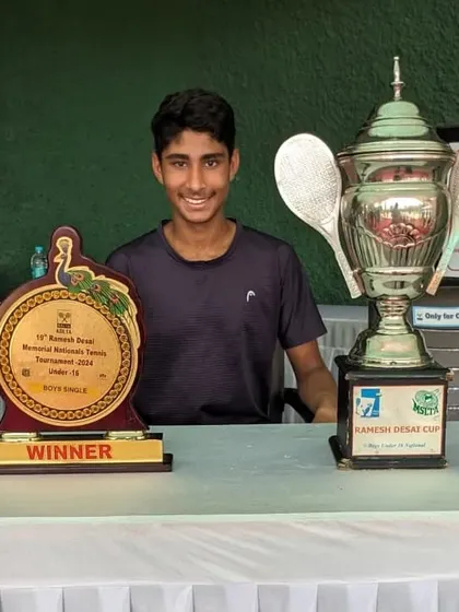 Tavish posing with his singles winner's trophy and the large perpetual cup at the U16 AITA Nationals.