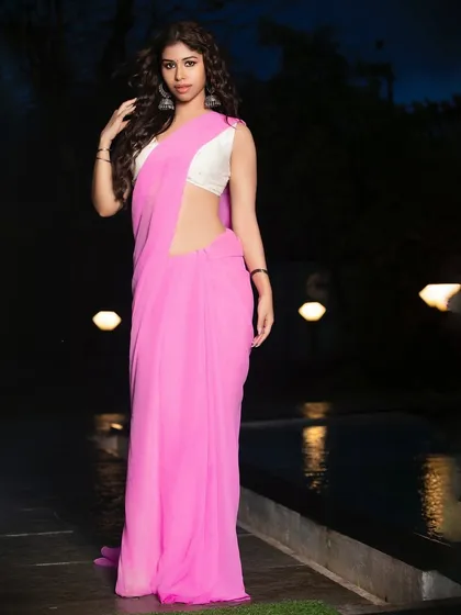A full-length portrait by the poolside at night. This image demonstrates how to create elegant ethnic fashion shots in a variety of settings and lighting conditions.