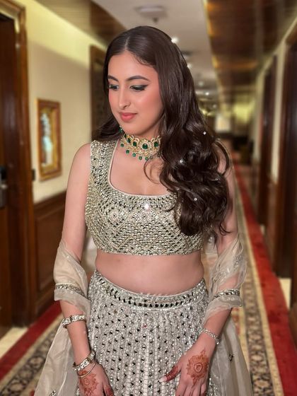 A statement green liner for Kriti's engagement. This was a fun way to add a pop of color that tied in with her jewelry, paired with glossy lips.