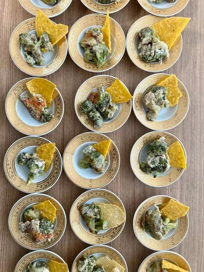 Another course from the silver service meal: crispy broccoli florets served with a nacho chip. This dish offered a delightful textural contrast.