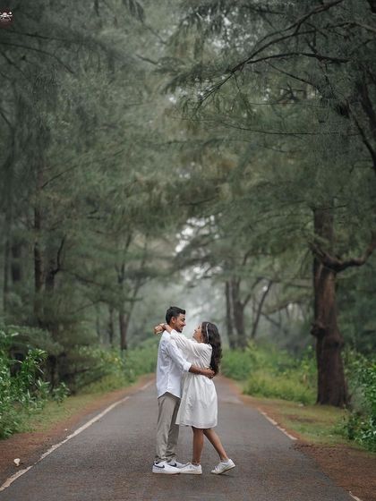A joyful, candid moment on a road cutting through the forest. This photo captures the feeling of being on a journey together.
