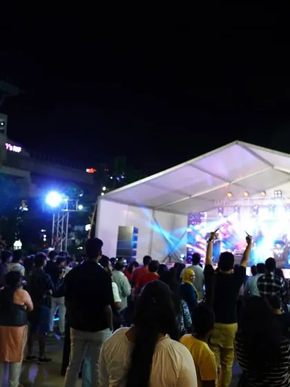 A different angle of the large crowd and our stage setup at Forum South Bengaluru, showing the scale of the event.