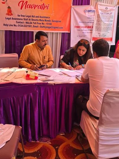 Assisting a visitor at the DLSA stall. We distribute informational pamphlets and provide on-the-spot counseling to demystify the legal process and inform people of their rights.