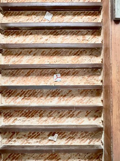 A repeat image of the exposed brickwork detail, showing the building's hidden layers.