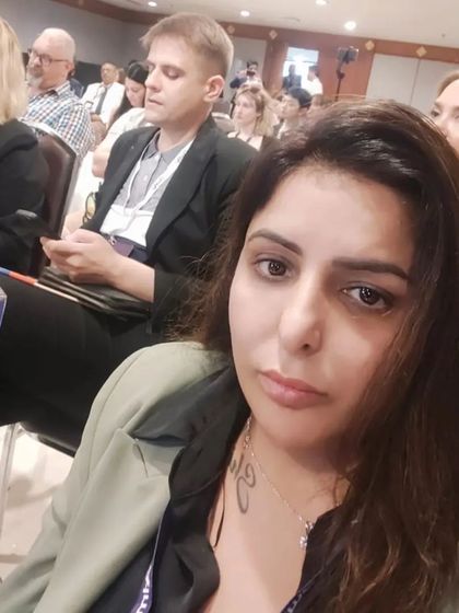 Dr. Ritu at an international aesthetics conference. This dedication to global best practices ensures we bring world-class treatments and knowledge back to our clients in Gurugram.