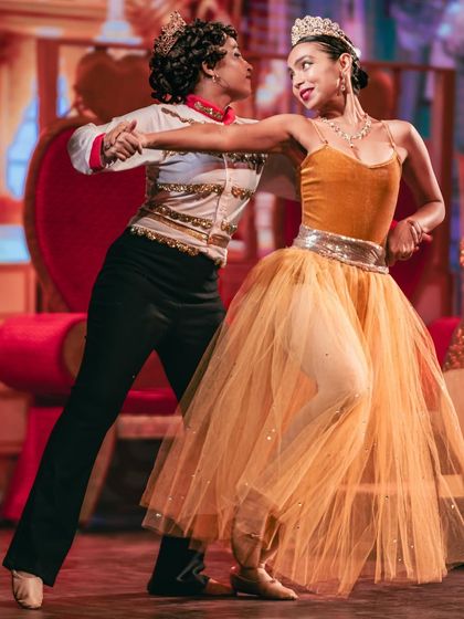 A dynamic shot of our King and Queen in performance. Their energy and chemistry captivated the audience throughout the show.