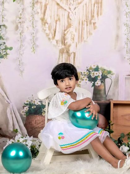 A sweet third birthday shoot with a bohemian theme, featuring natural textures, greenery, and a calm, peaceful vibe.