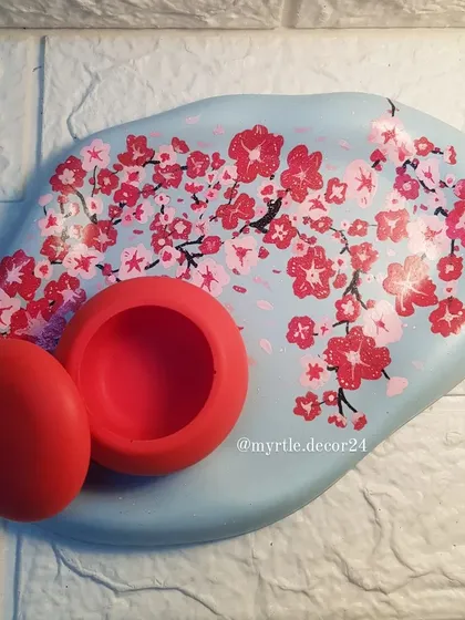 An overhead view of our cherry blossom cloud tray and mini round jar, a perfect pairing for a vanity or dresser.