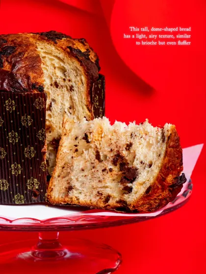 A slice of the Triple Chocolate Panettone, showing the light, fluffy texture and generous chocolate chunks.