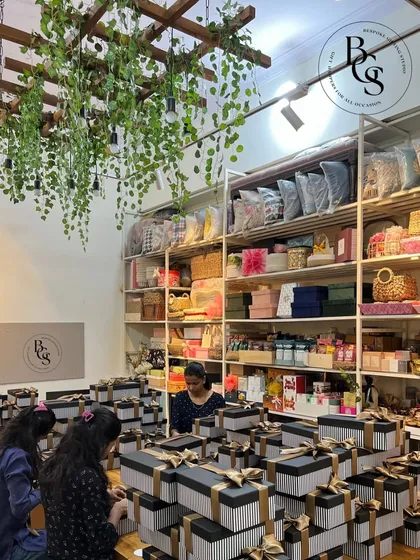 A full view of our studio during a busy period. The space is filled with stacks of corporate gift boxes, showcasing our capacity to handle large-scale orders while maintaining a high standard of quality.