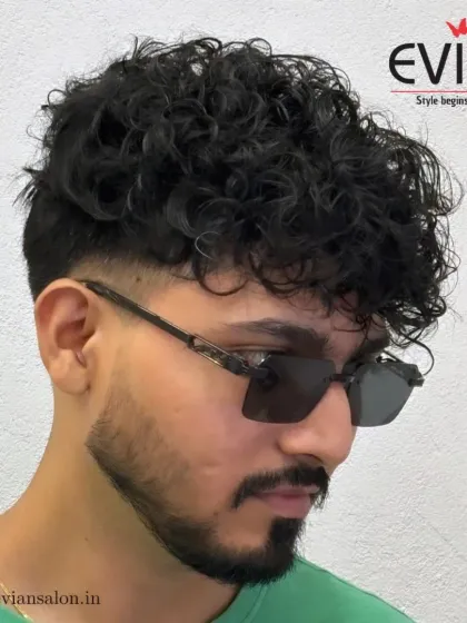 Another angle showcasing the sharp lines and texture of this men's haircut. It's a versatile look that can be styled in different ways.