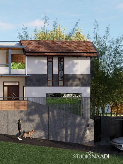 The design of this hillside home in the Western Ghats is a blend of contemporary architecture and traditional Kodava style. The use of natural materials and strategic placement on the slope creates a home that feels rooted in its place.