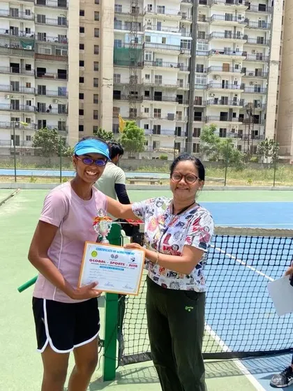 Khushi Sharma receiving her runner-up trophy for the U-16 girls' singles category.