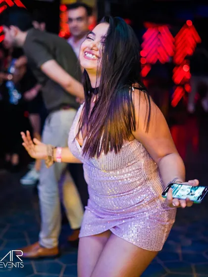 A guest dancing with a smile.