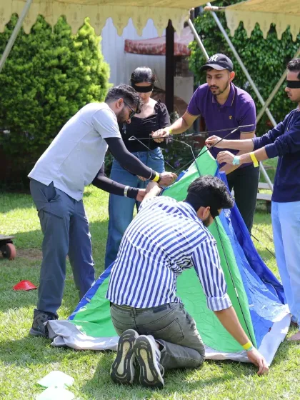 Forget boring trust falls. We design unique team bonding activities like this blindfolded tent pitching challenge. It is a fun, hands-on problem solving game that requires communication, collaboration, and a lot of laughter to succeed, revealing leadership skills you might not see in the office.