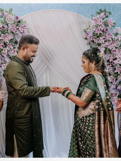 The moment of the ring exchange, a pivotal point in the engagement ceremony, captured up close.