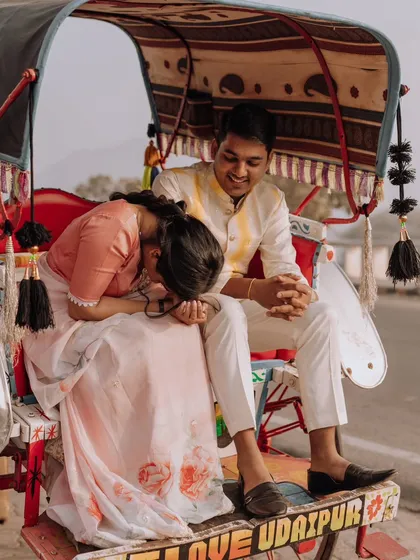 A moment of shared laughter during their rickshaw ride. These candid shots are perfect for showing the couple's genuine connection and joy.