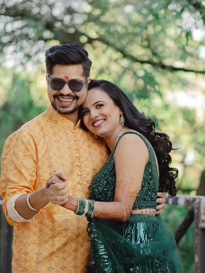 A joyful, candid portrait of a couple dancing and smiling in a garden. I encourage couples to be themselves, which results in natural and happy photographs like this one.