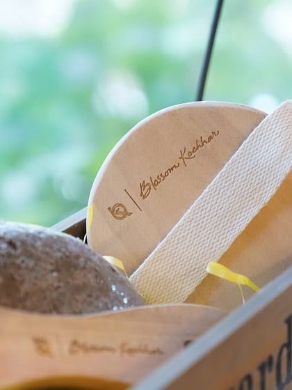 A close-up of our beautifully crafted wooden exfoliating pad, a perfect tool for gentle yet effective skin polishing.