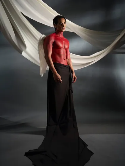 The addition of small white wings adds a mythological element to the red body paint concept, creating a fallen angel narrative.