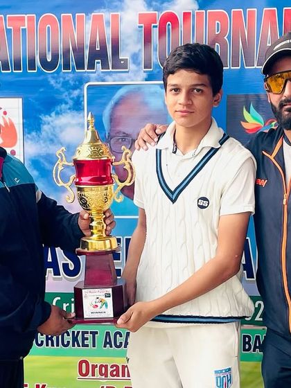 Another shot of our player receiving the trophy.