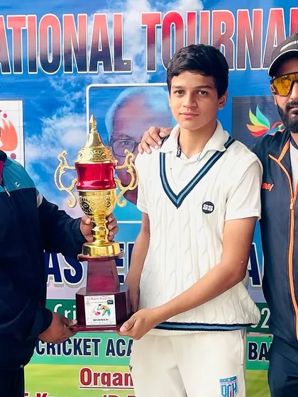 Another shot of our player receiving the trophy.