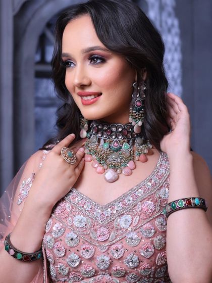 A happy and confident model. The makeup is designed to look flawless on camera, with a focus on glowing skin and beautifully defined eyes.